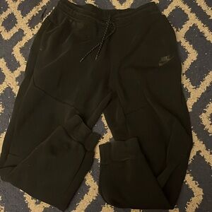 Men’s black Nike tech pants